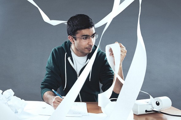 Man using calculator - How Rising Interest Rates Impact Buying vs Renting