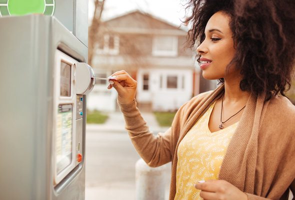 A woman using an ATM.