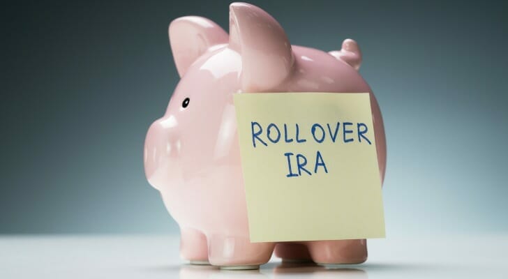 Piggybank with "rollover IRA" written on it.