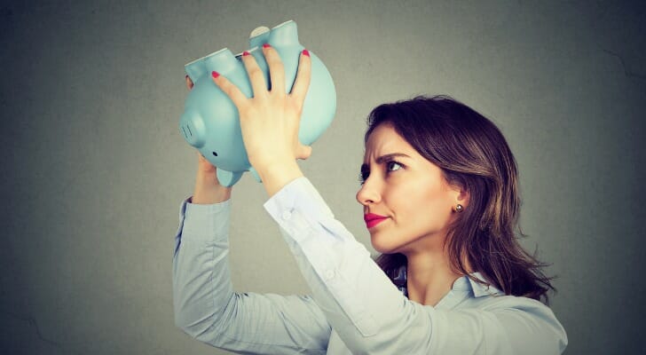 Woman with a piggy bank.
