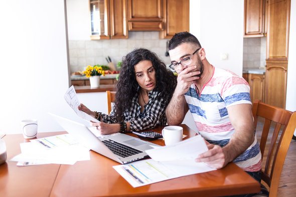A husband and wife deciding whether to file separately or jointly.