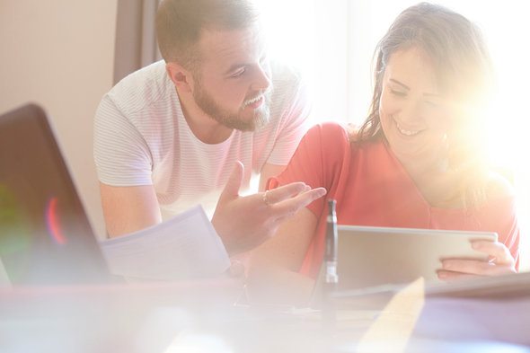 A man talks with his sister about her tax returns.