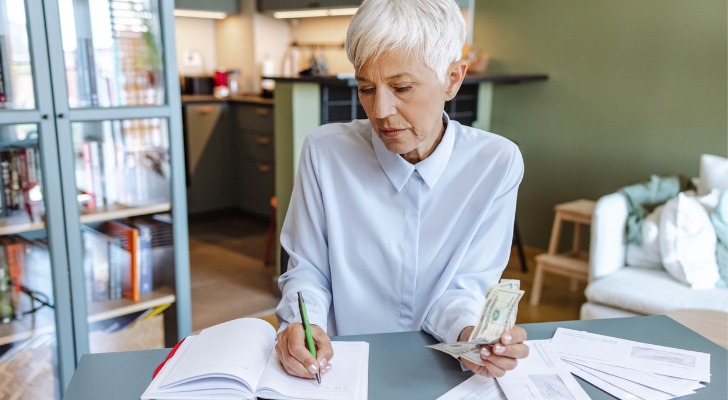 A senior reviewing her pension plan.