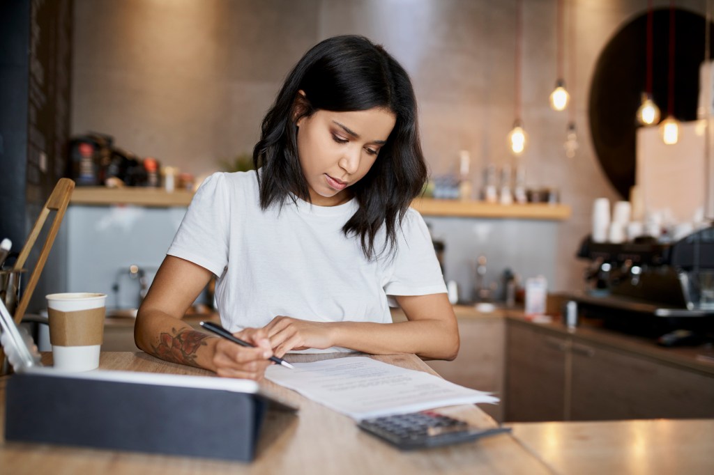 A woman filing her taxes.