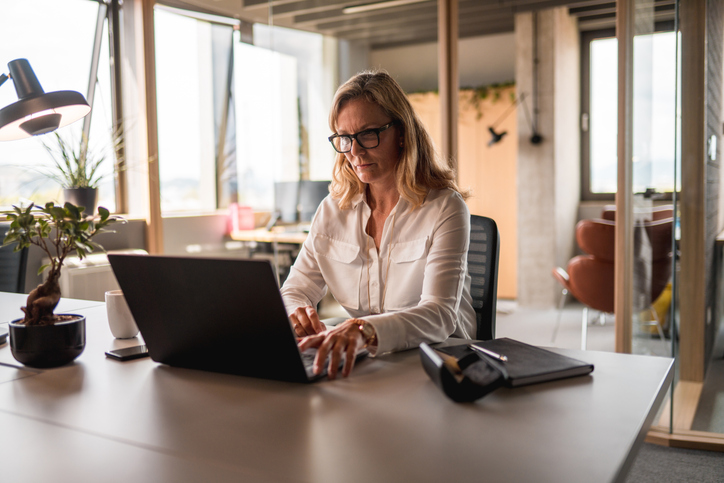 A woman reviewing the average retirement savings for her age group.