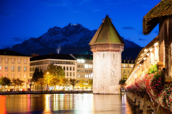 Lucerne Switzerland Reuss Chapel bridge at twilight.
