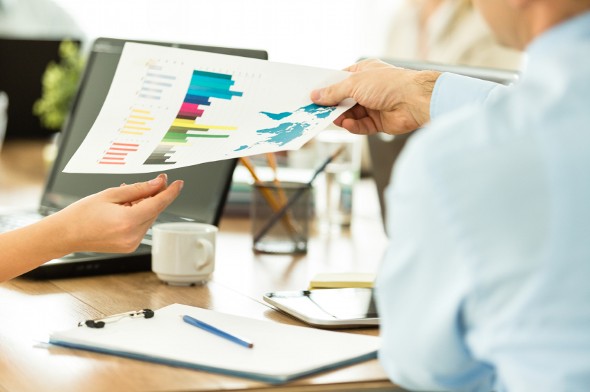 Two investors review potential investments.