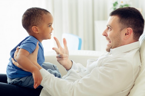 Father playing with his son.