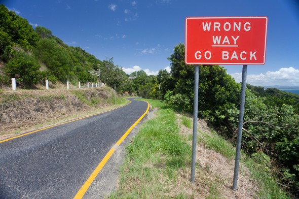 Red sign: "Wrong Way. Go Back."