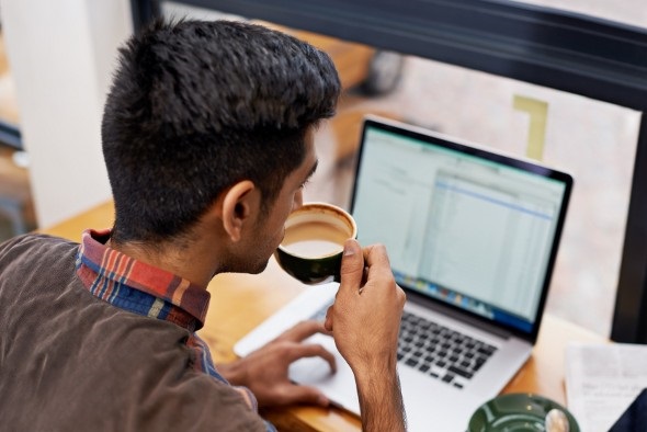 A man files his taxes online, from the comfort of his home.