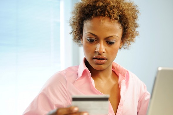 A woman reviewing how ChexSystems works.
