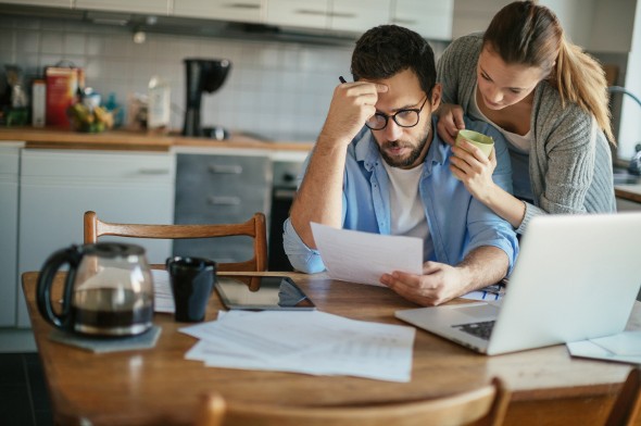 A couple checking their bank account.
