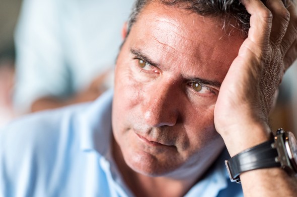 A man debates whether or not to use a passbook savings account.