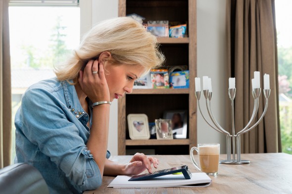 A woman reviewing the annual percentage yield on her account.