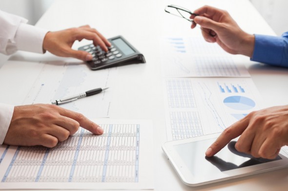 An advisor and client review a tax return flagged for review.