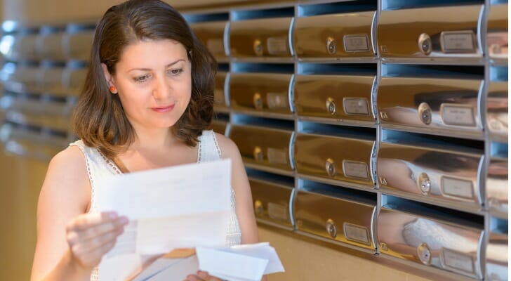 A woman reviews a tax return flagged for review.