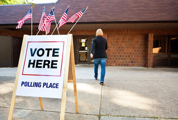 A voter walking into a polling place to vote.