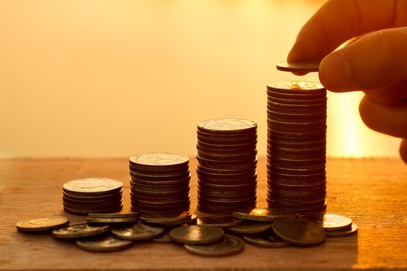 A saver stacking coins.