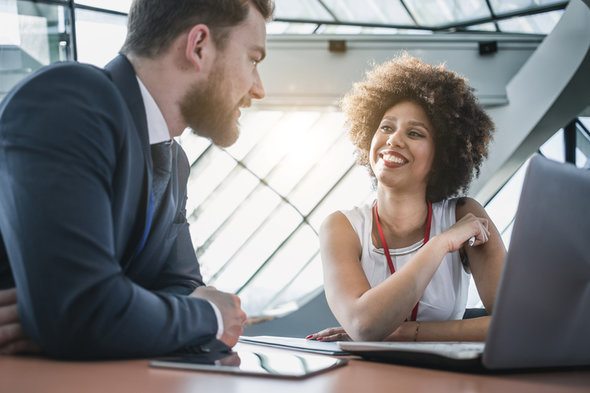 A man visits a bank branch to open a bank account.