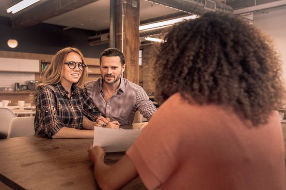 A couple meeting with their financial advisor.
