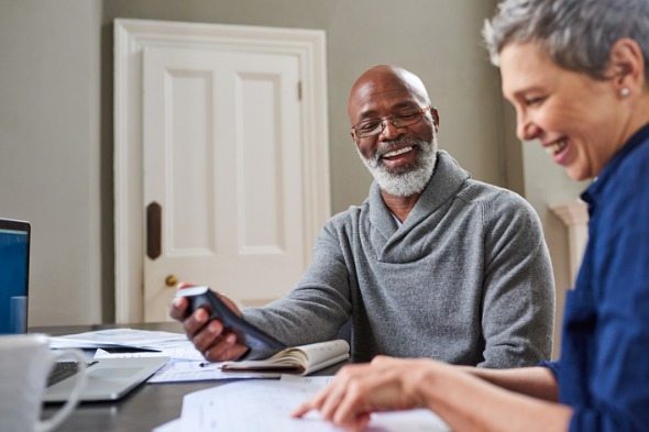 Financial advisor and client reviewing IRA CDs and rates.