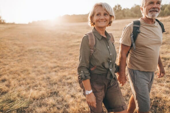 A husband and wife traveling during their retirement.