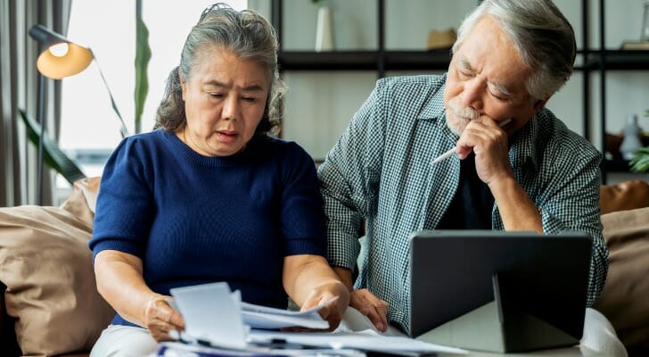 A couple reviewing their retirement budget.