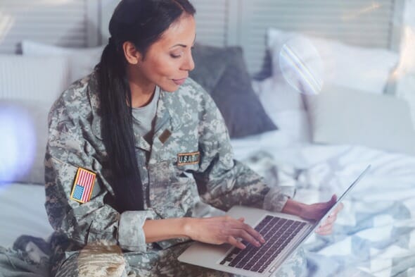 A soldier evaluating bank offerings from USAA and Navy Federal Credit Union.