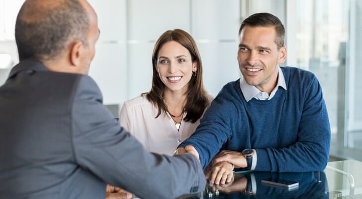 A couple meeting with a bank manager.