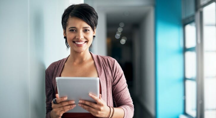 A woman reviewing a Thrift Savings Plan, or TSP.