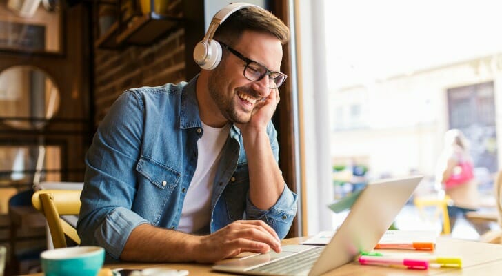 A man comparing checking account fees.