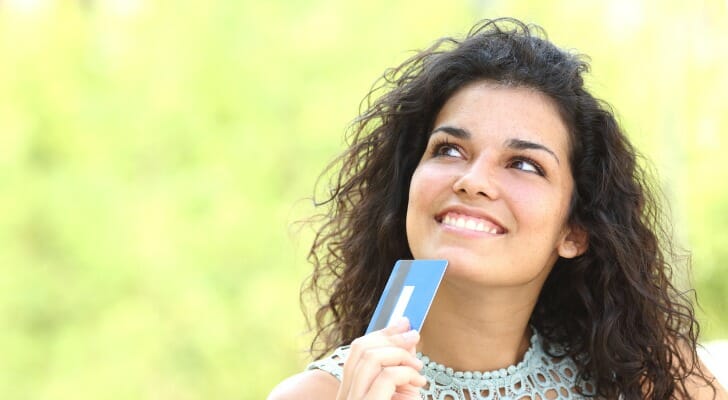 A woman deciding which bank to use.