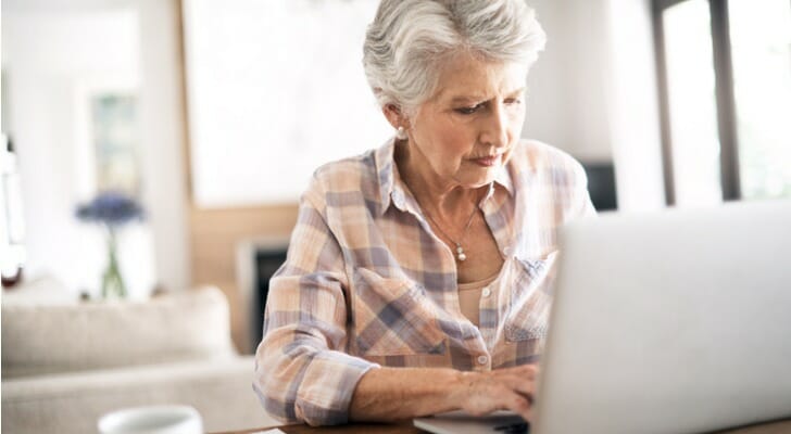 A woman reviews backdoor Roth IRA strategies.