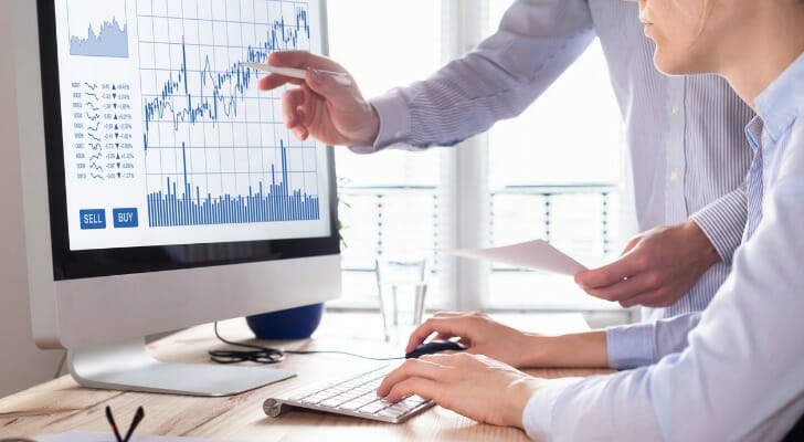 Investment brokers at work in their office.