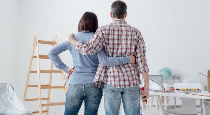 A couple examining the construction work that they will have to complete.