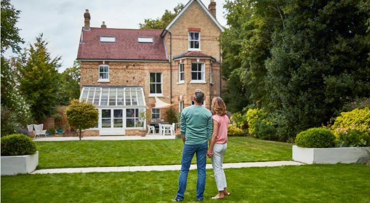 Homeowners looking at a home before they begin construction.
