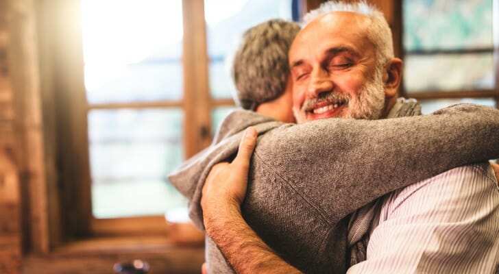 Family members embrace, having created a living trust to protect their family's assets.