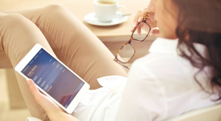 A woman checking her bank account online.