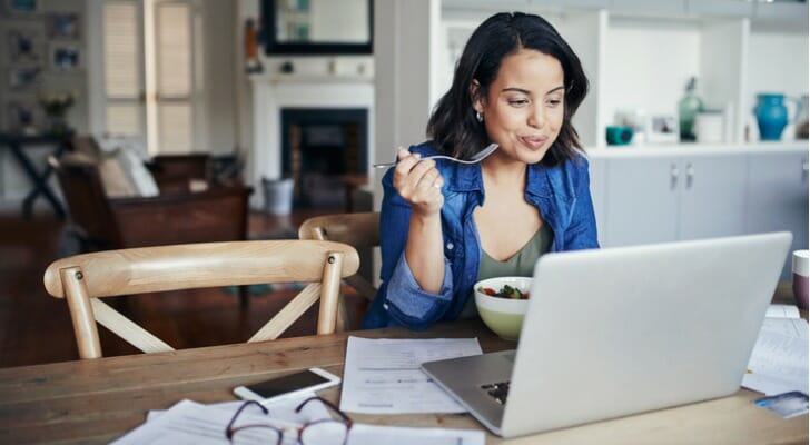 A woman reviewing her bank statements.