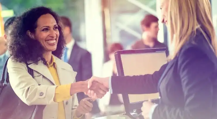 A woman at her bank to transfer money.
