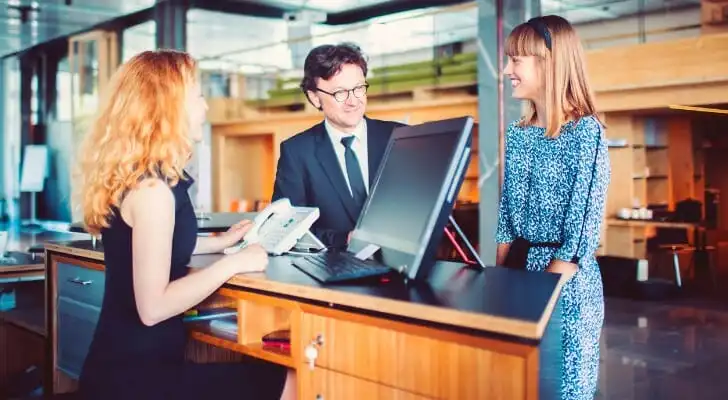 A client speaking with a bank manager at a branch.