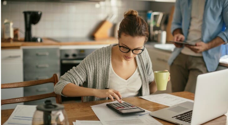 A woman reviews how to open a savings account.