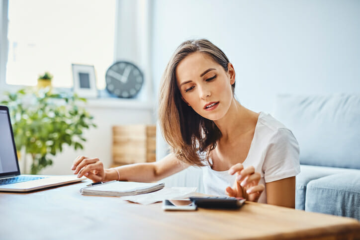A woman reviewing her high-yield savings account.