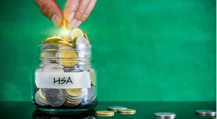 A jar full of change, labeled "HSA."