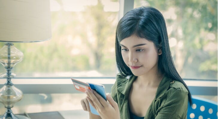 A woman looks up how to open a savings account.
