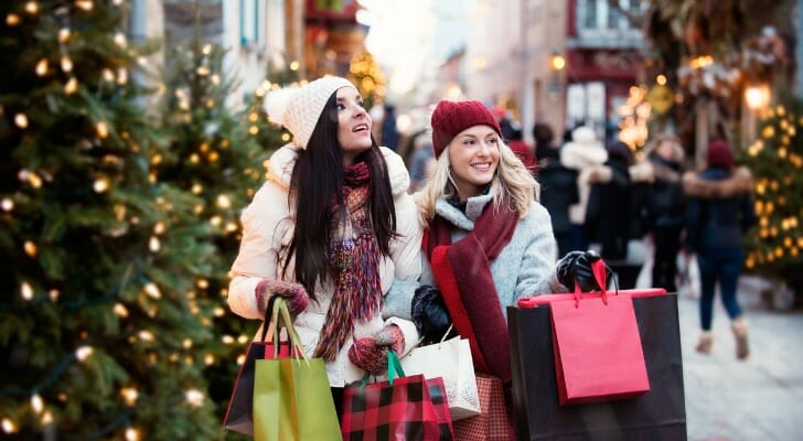 Two women Christmas shopping on Black Friday.