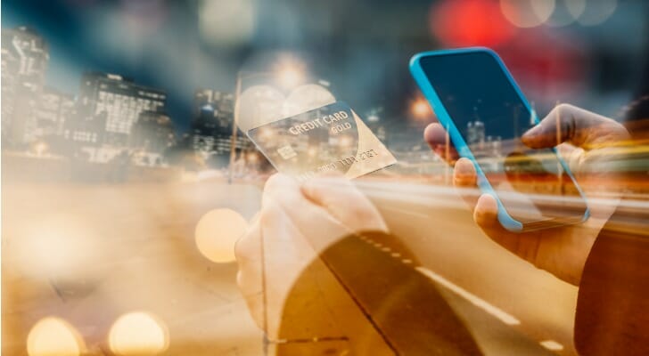 A man holding a credit card.