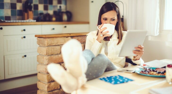 A woman comparing two bank offerings.