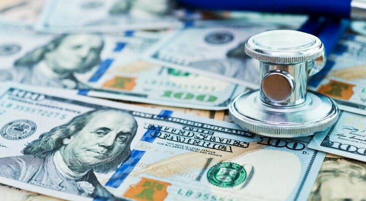 Paper currency spread out on a table.