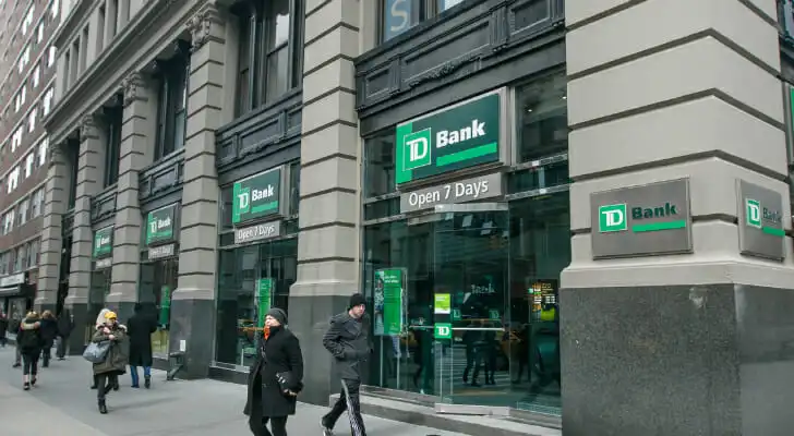 An image showing the outside of a TD Bank branch in a city.